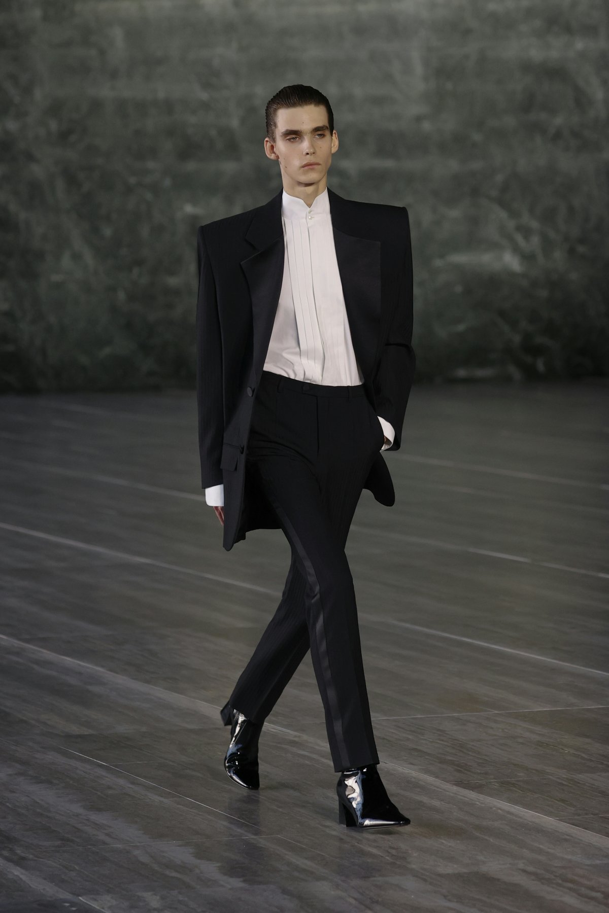 A model in a black and white suit.