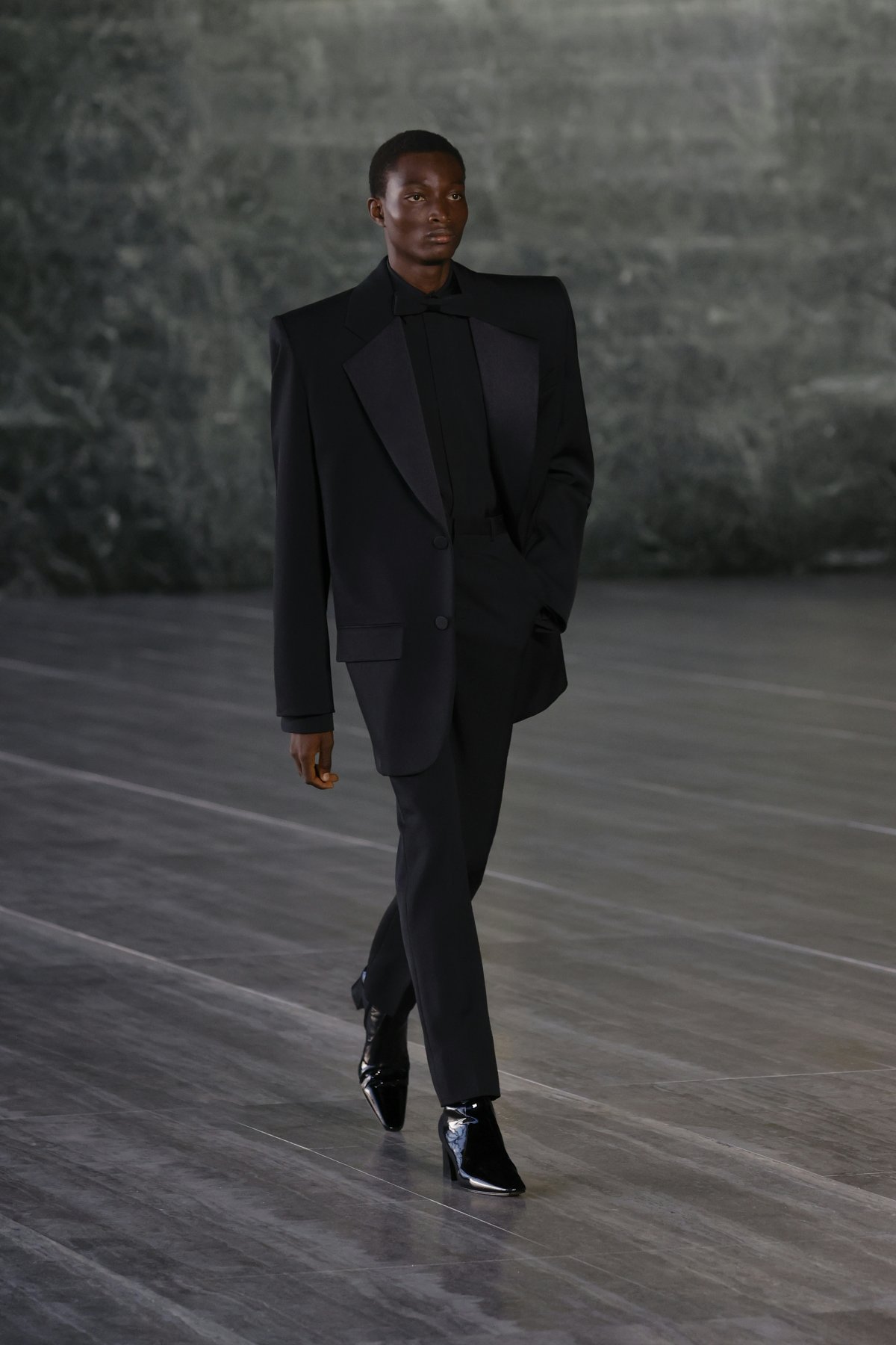 A model in a black suit.
