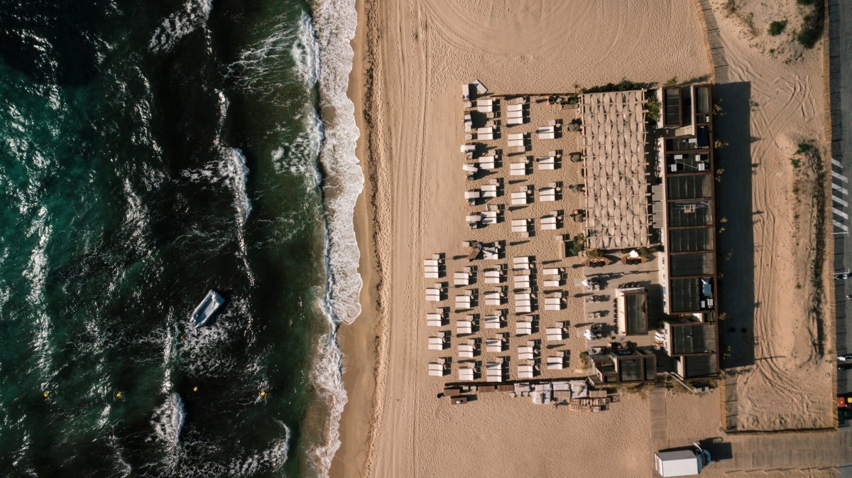 nature outdoors sea water shoreline coast aerial view building waterfront boat