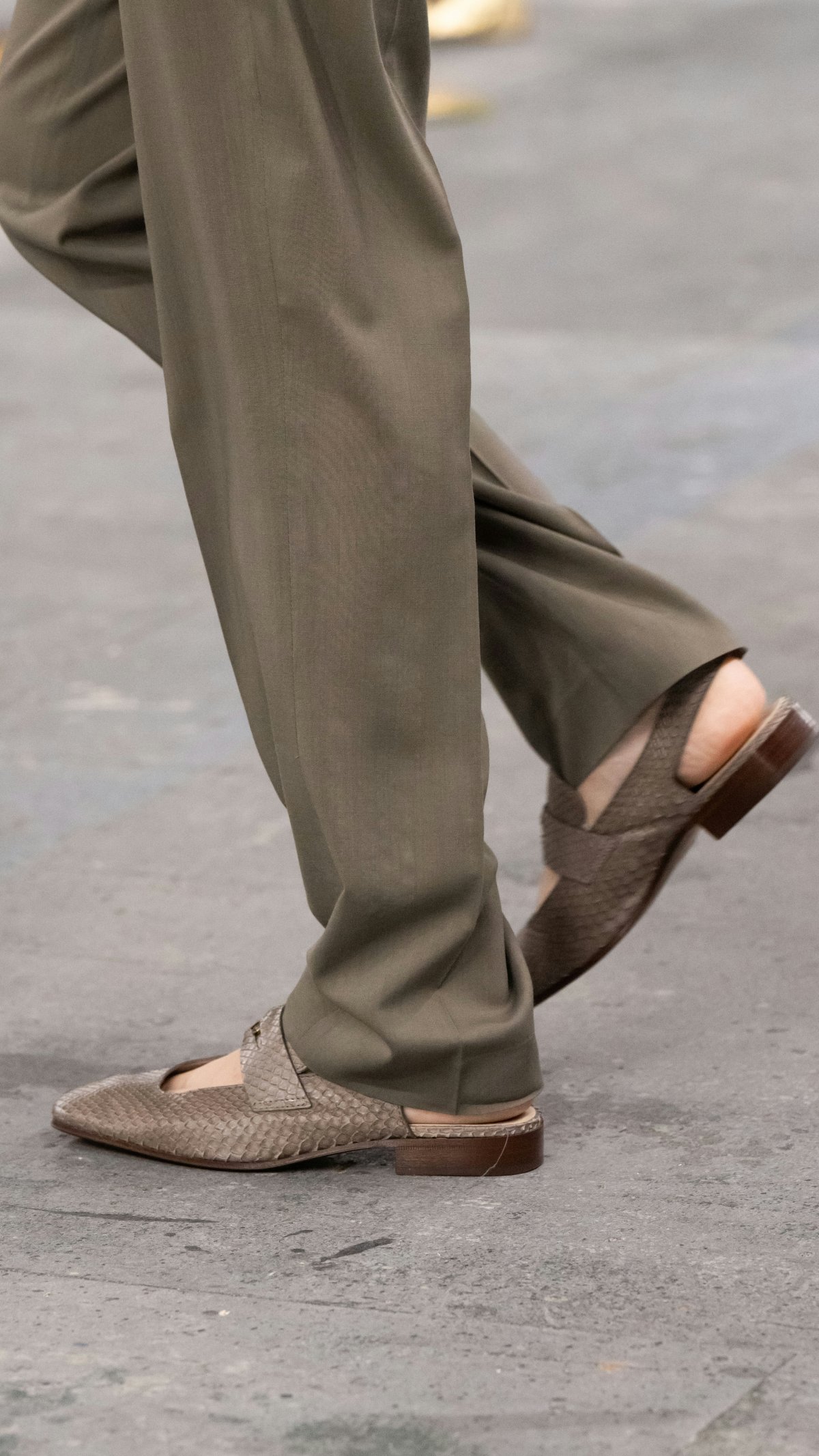 clothing footwear shoe person walking sandal pants sneaker