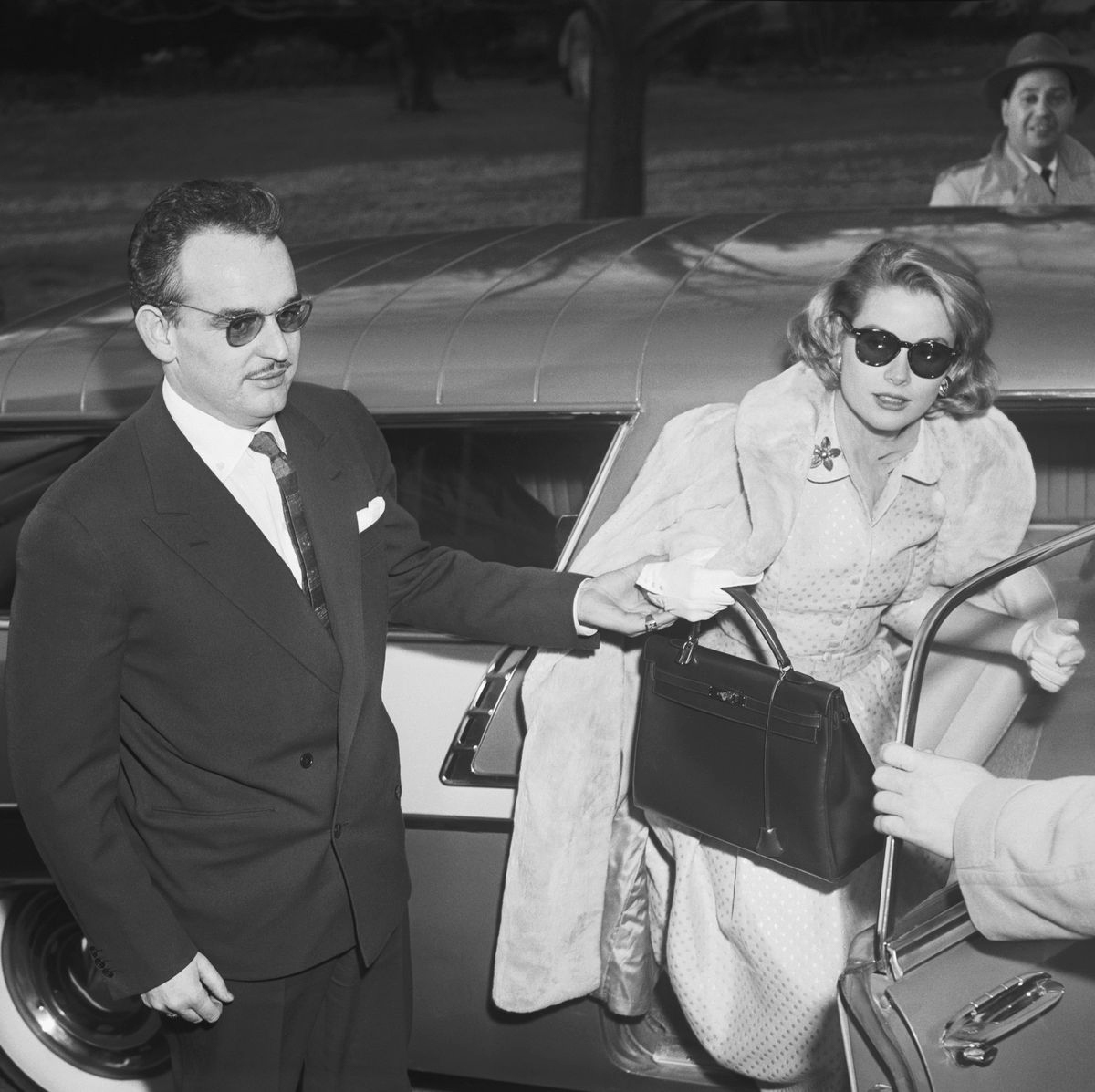 accessories bag handbag coat sunglasses purse suit adult man person