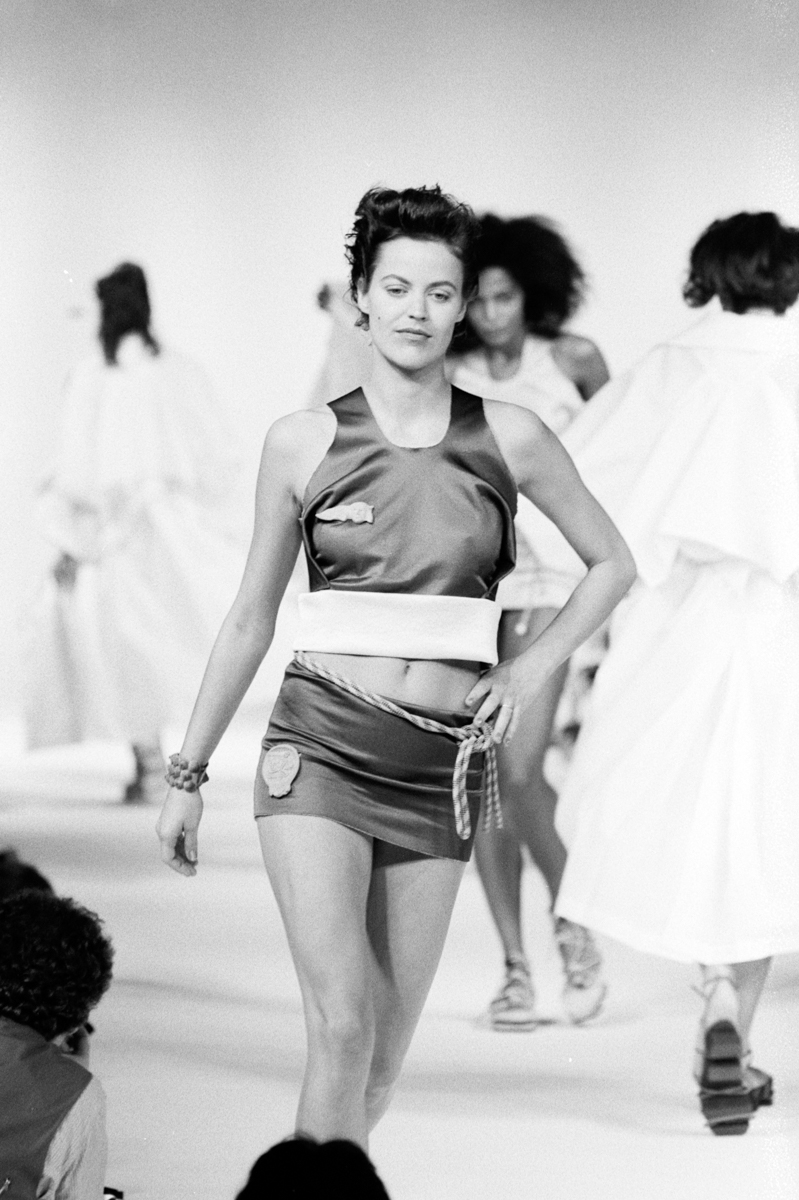 model on runway wearing cropped tank and skirt