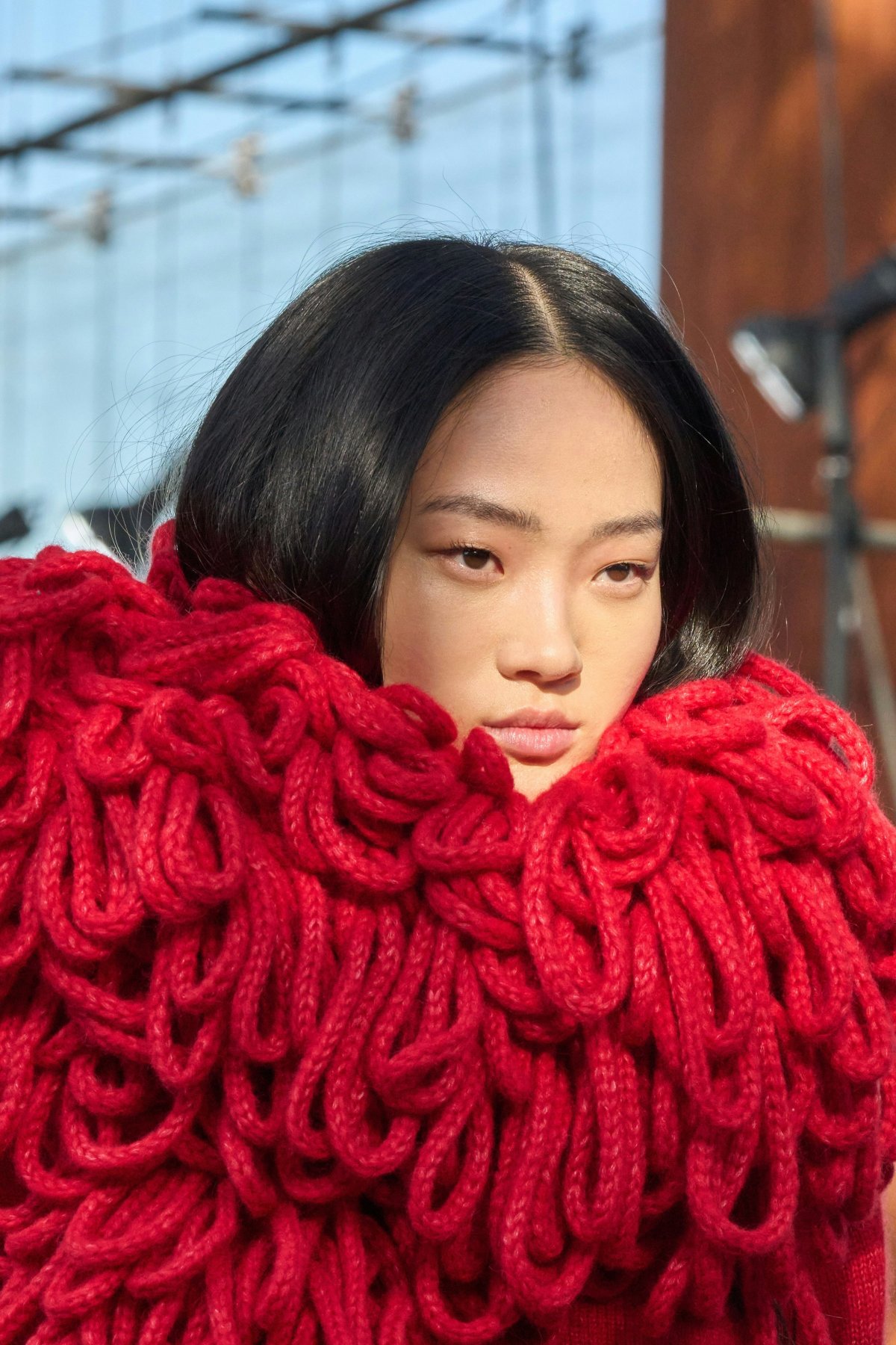 adult female person woman face head clothing knitwear sweater blanket