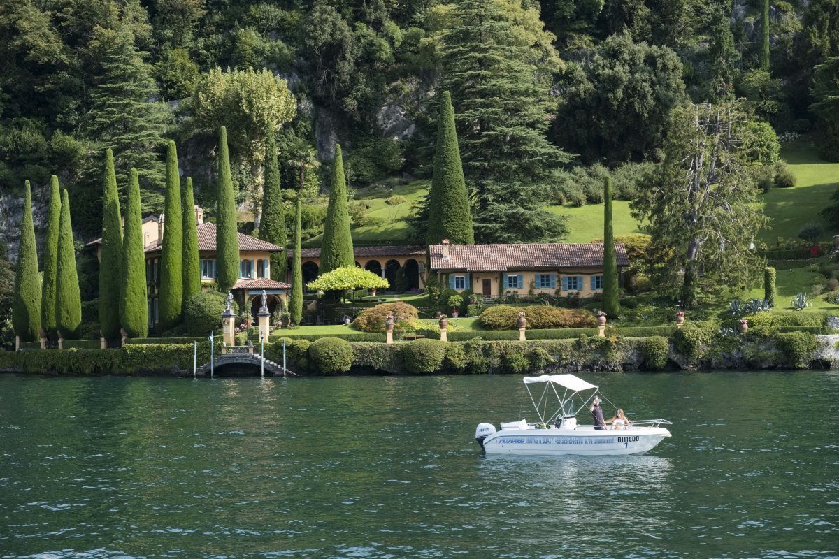 photo with lake, garden, and villa