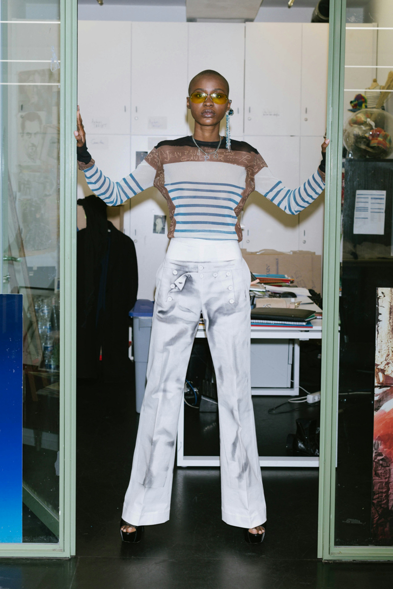 pants person standing blouse necklace adult male man linen jeans