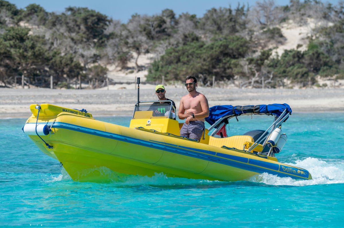 boat vehicle person boating water water sports watercraft glasses hat wristwatch