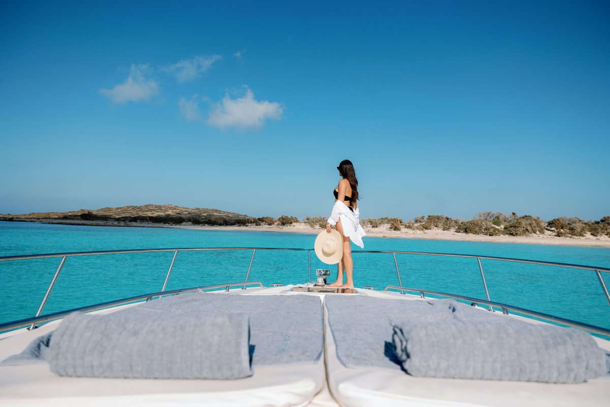 beachwear clothing person hat vehicle yacht accessories glasses vacation outdoors