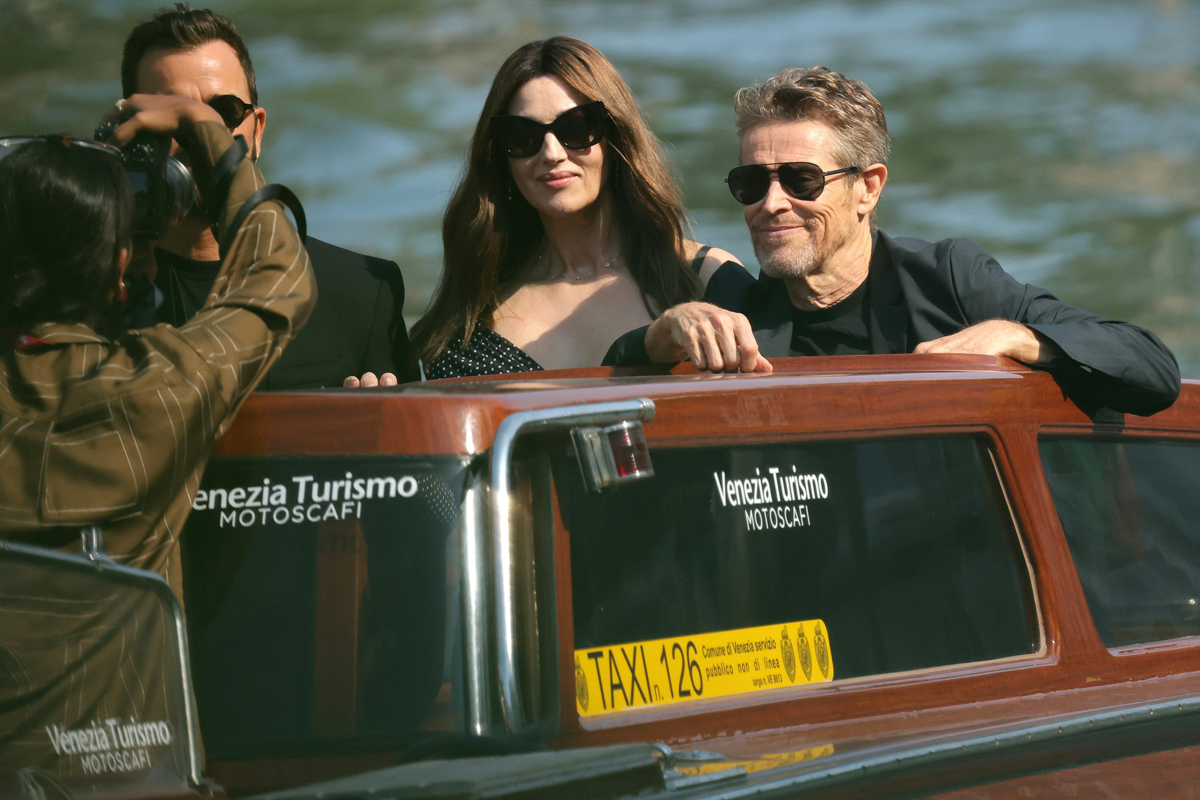 Monica Bellucci, accompanied by Justin Theroux and Willem Dafoe arrives at the Lido of Venice (Getty Images)