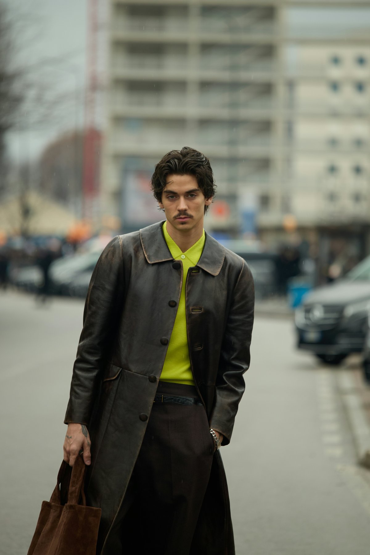 coat jacket overcoat bag adult male man person handbag long sleeve