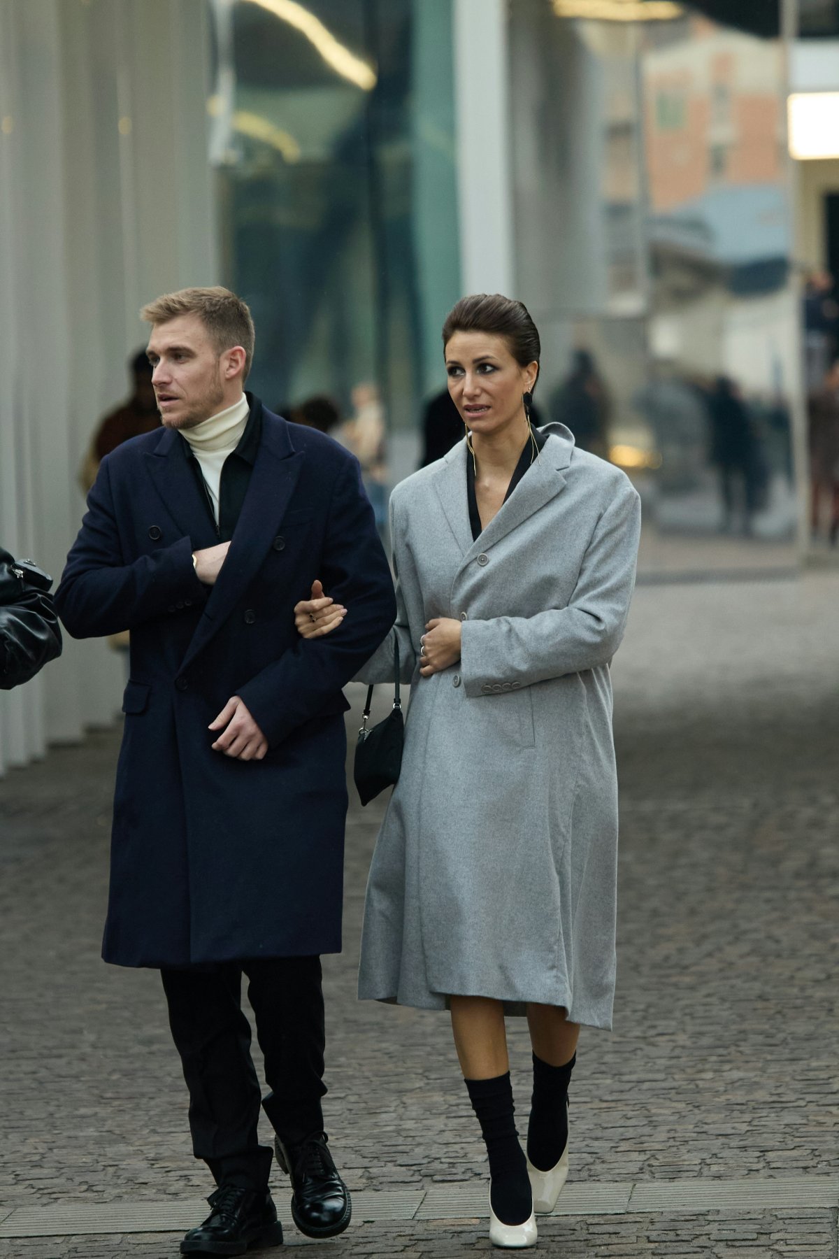 clothing coat lady person overcoat handbag adult male man face