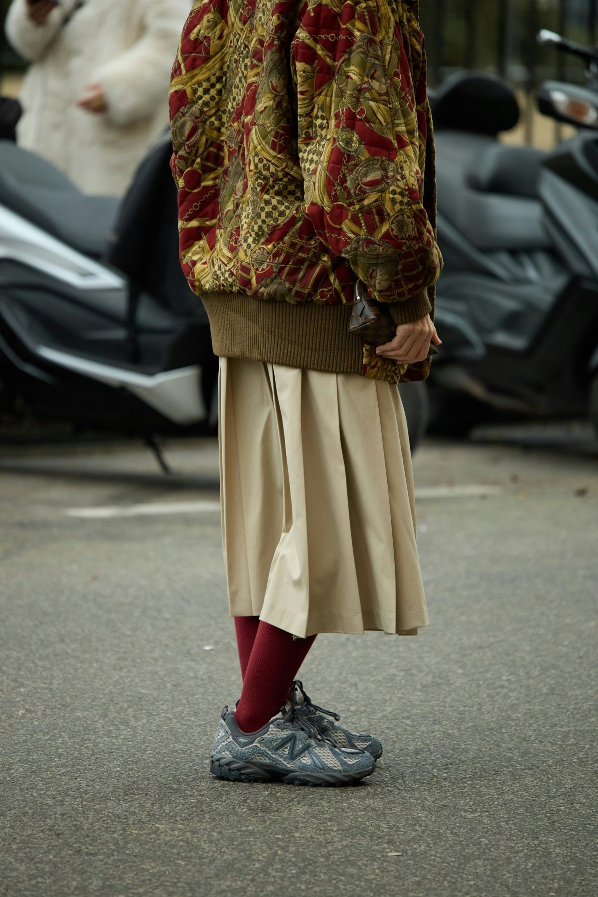 clothing skirt footwear shoe adult female person woman coat handbag