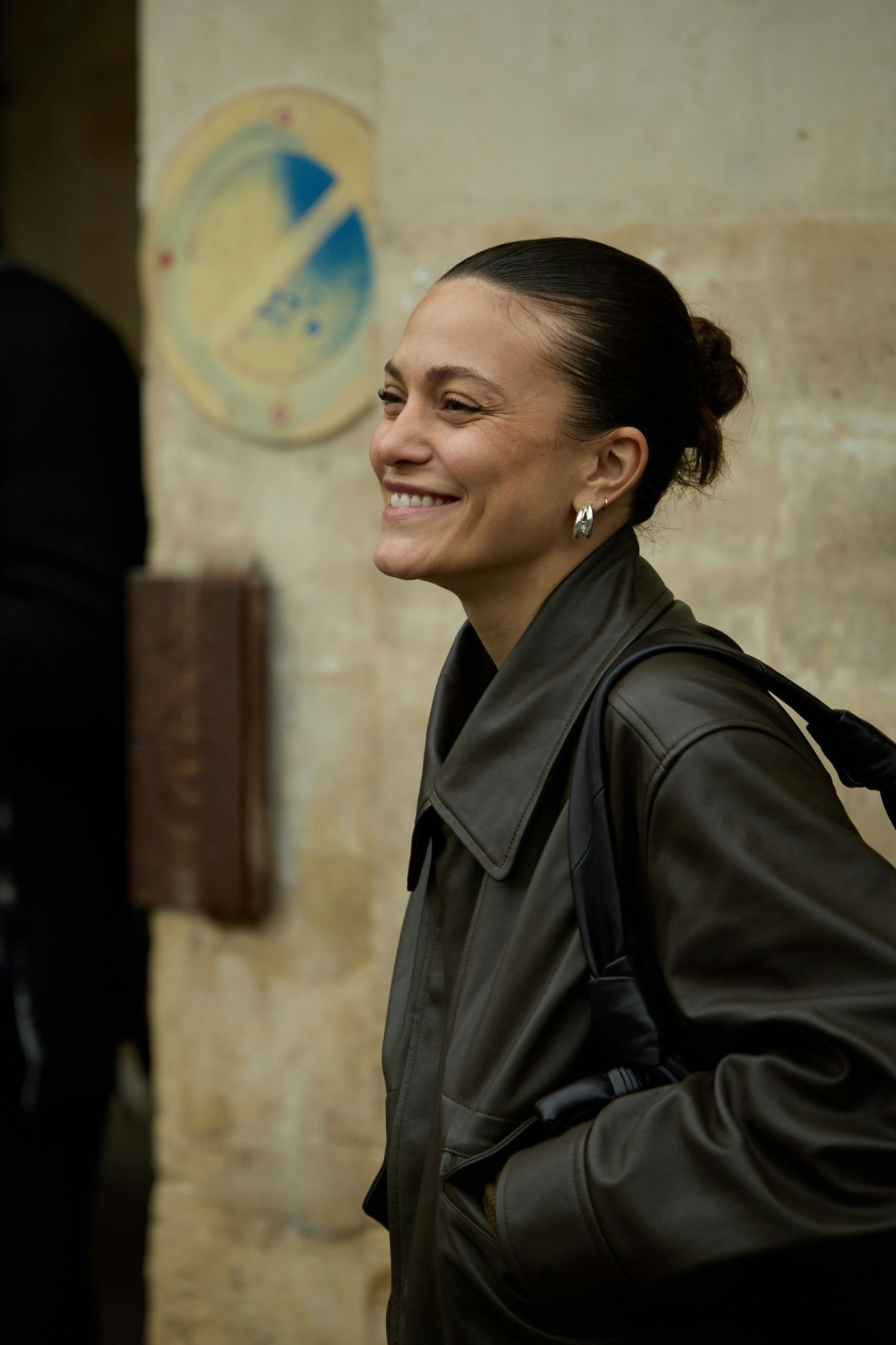 coat jacket person smile portrait earring adult female woman long sleeve