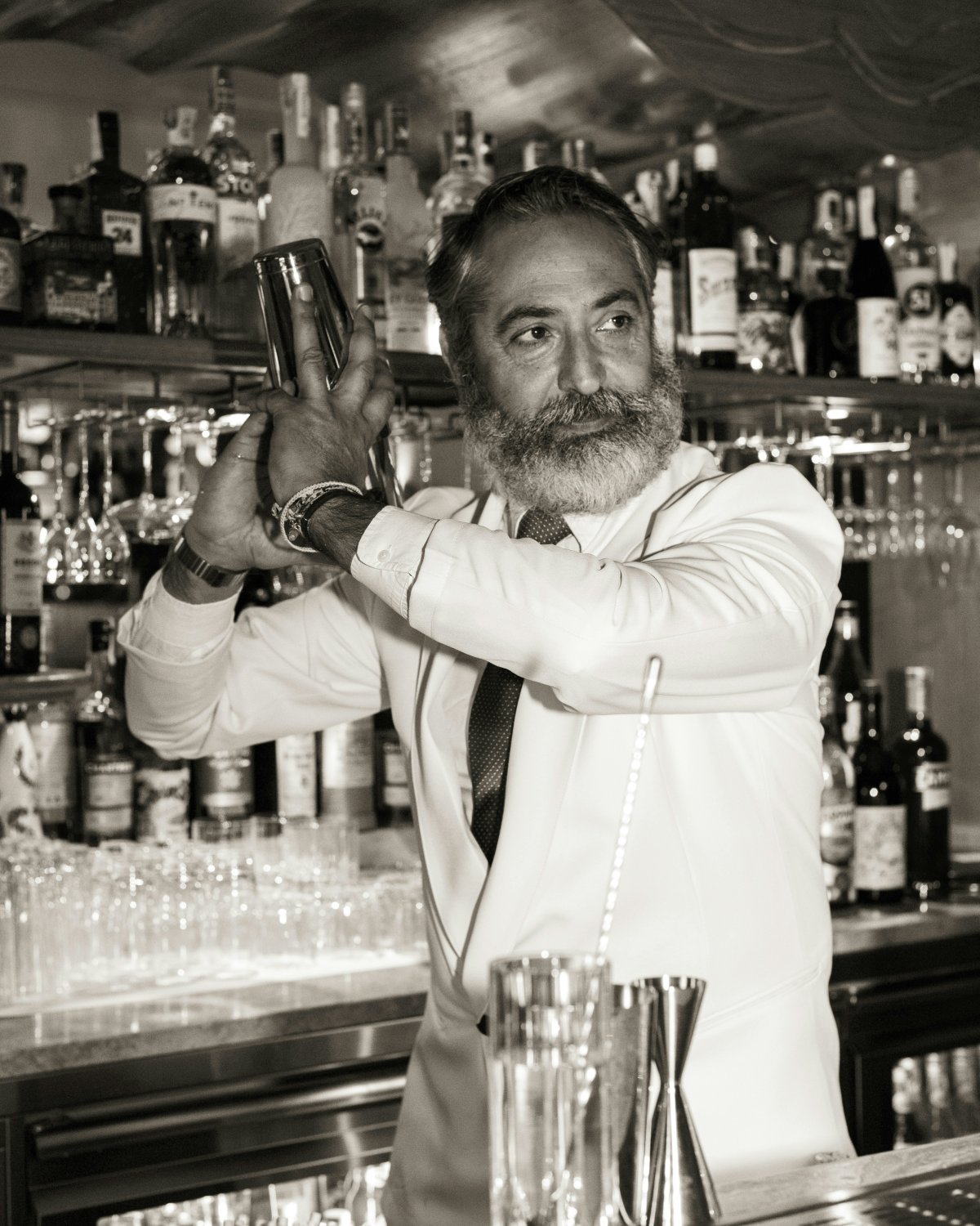 alcohol bartender beverage person adult male man formal wear tie bracelet