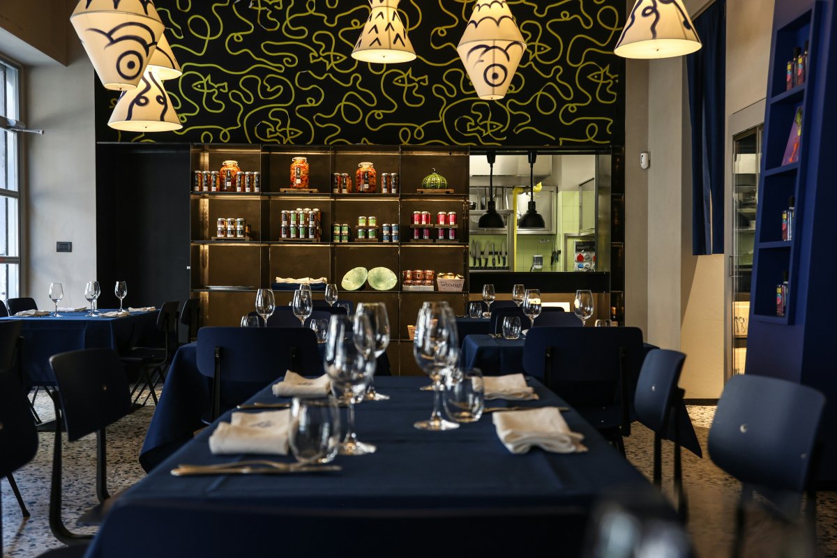 polpo dining room dining table indoors table restaurant lamp cafe cafeteria cup chair