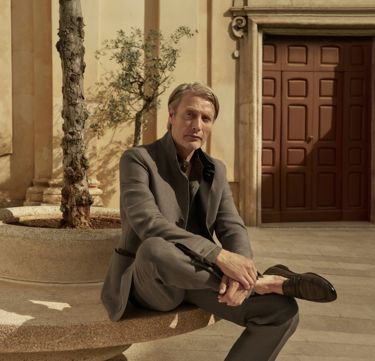 person sitting formal wear suit adult male man shoe coat portrait